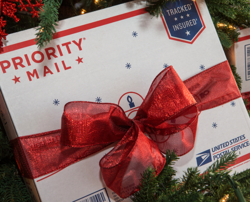 USPS Priority mail with a red holiday ribbon