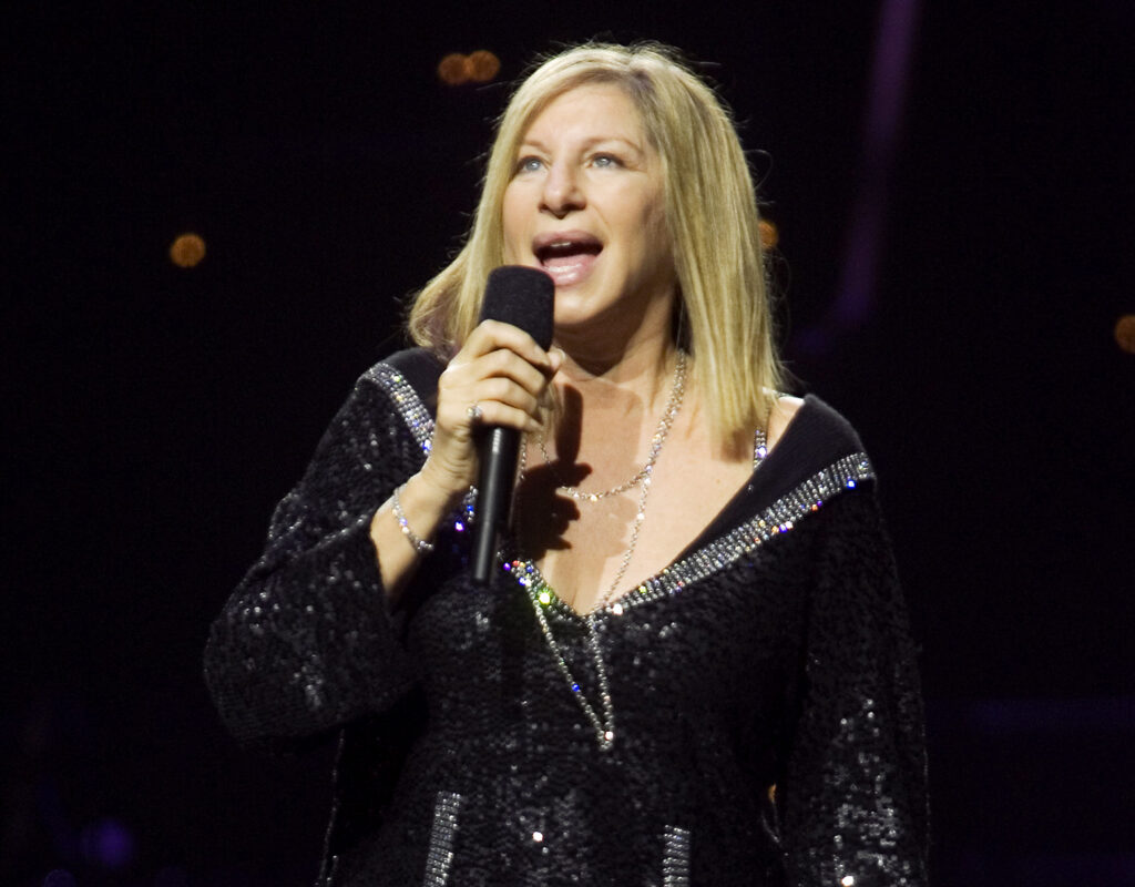 Barbra Streisand singing with mic in hand