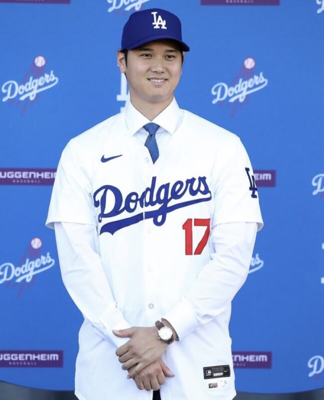 Ohtani wearing Dodgers cap and shirt