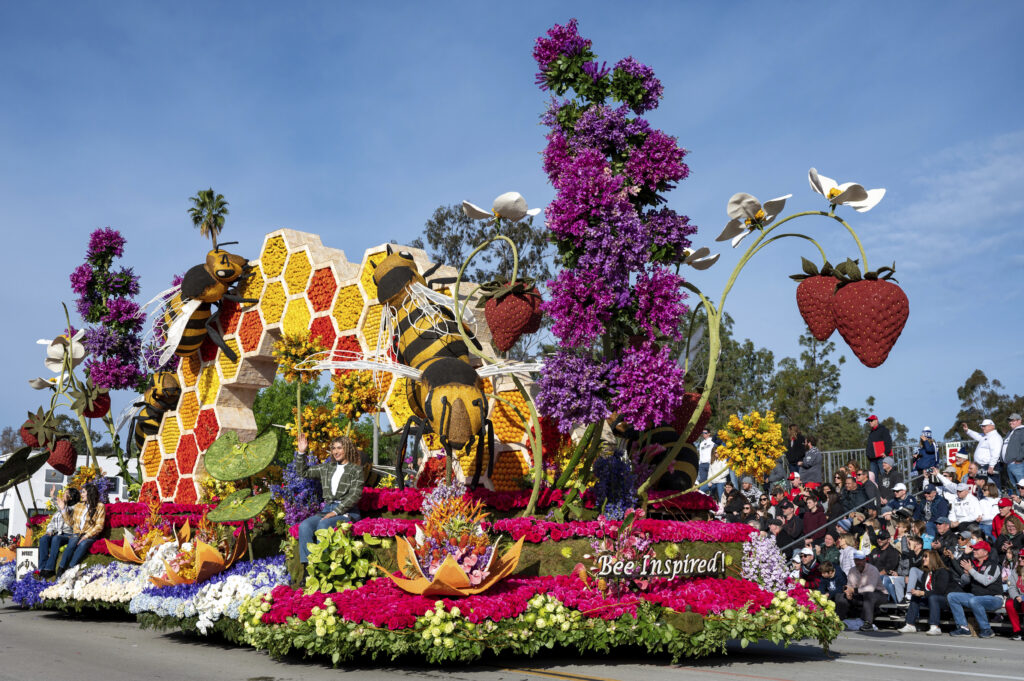 Rose Parade float bedecked with colorful flowers
