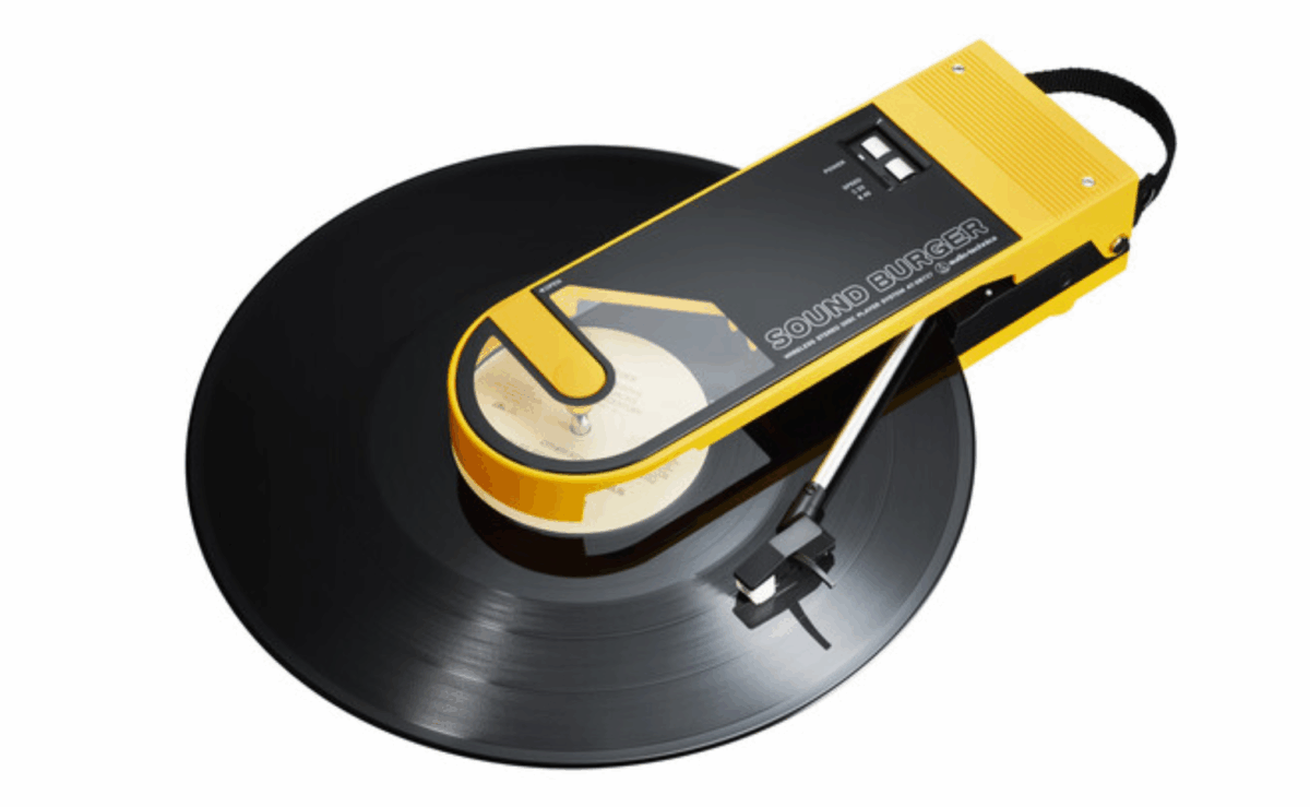 Audio-Technica Sound Burger portable turntable playing a vinyl record.