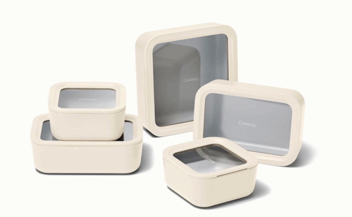 Caraway ceramic-coated glass food storage containers arranged with matching lids and organizers.