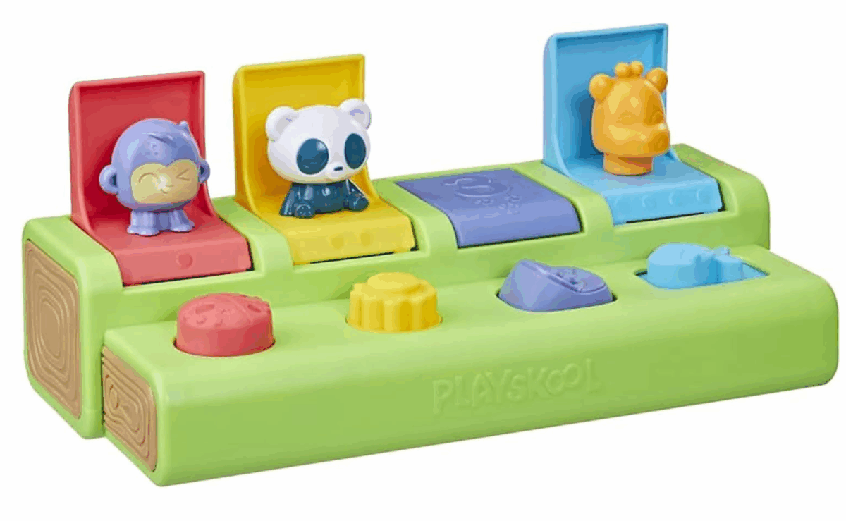 Baby interacting with Playskool Busy Poppin’ Pals pop-up toy featuring colorful animal buttons.