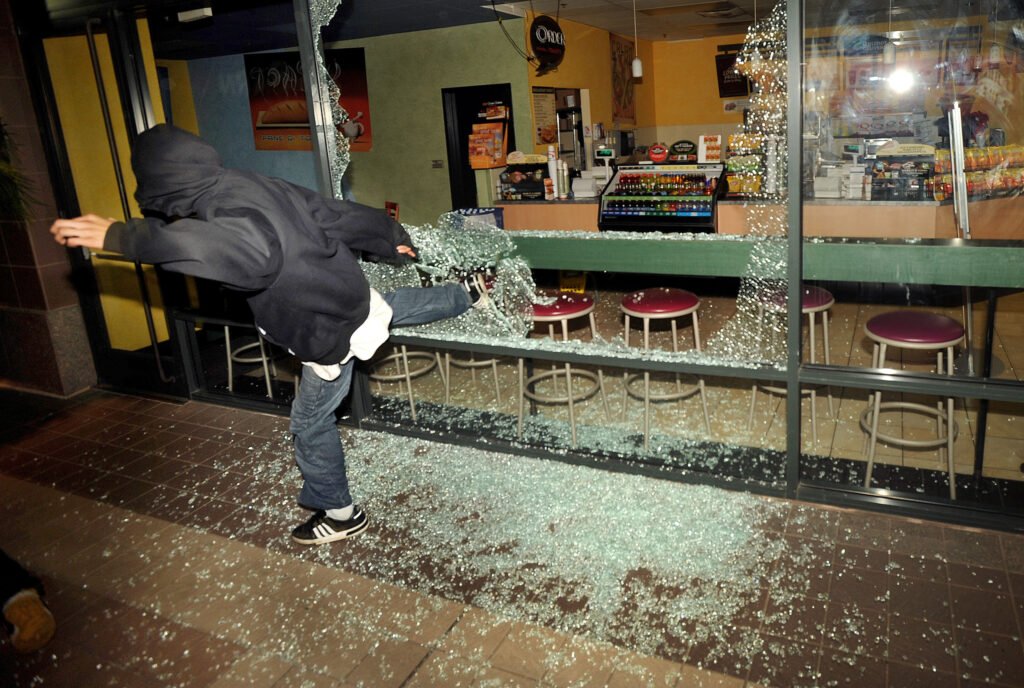 Man smashes coffee shop's glass window