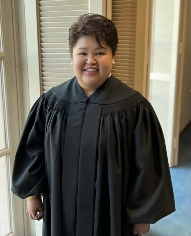 Christine Gonong wearing judge's black gown