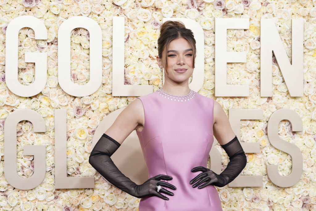 Hailee Steinfeld in a pink gown with black gloves
