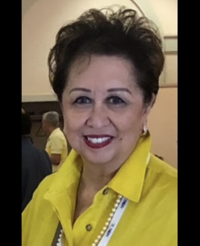 Headshot of Joanne del Rosario in yellow shirt