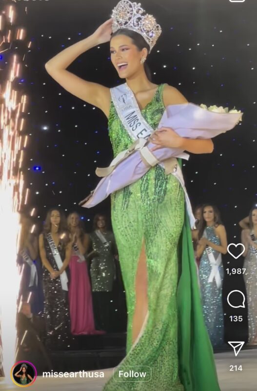 Miss Earth USA in green gown holding bouquet of flowers