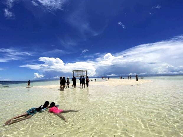 Tourists enjoy the white sand beach of Virgin Island in Panglao, Bohol, in this photo taken in August 2022. Bohol, known for its pristine environment and ecotourism destinations, is the Philippines’ first global geopark recognized by the United Nations’ cultural agency for its unique geological heritage. Photo by Leo Udtohan/Philippine Daily Inquirer