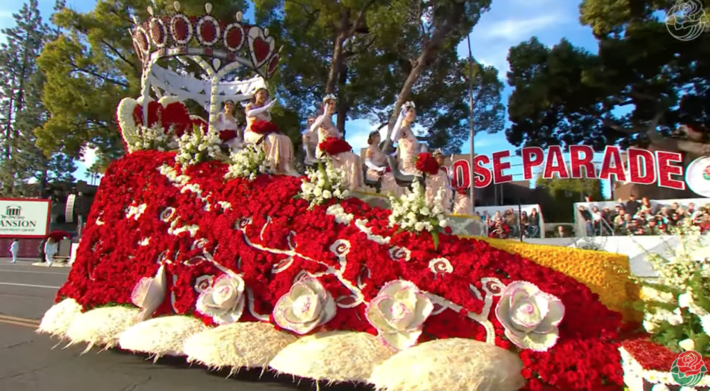 Rose Court on float bedecked with red roses