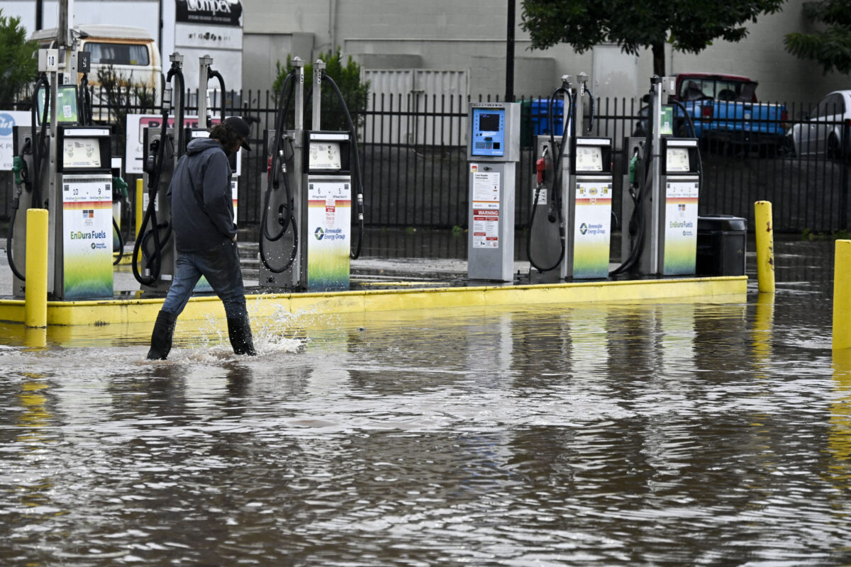 Man walking on flooded street
