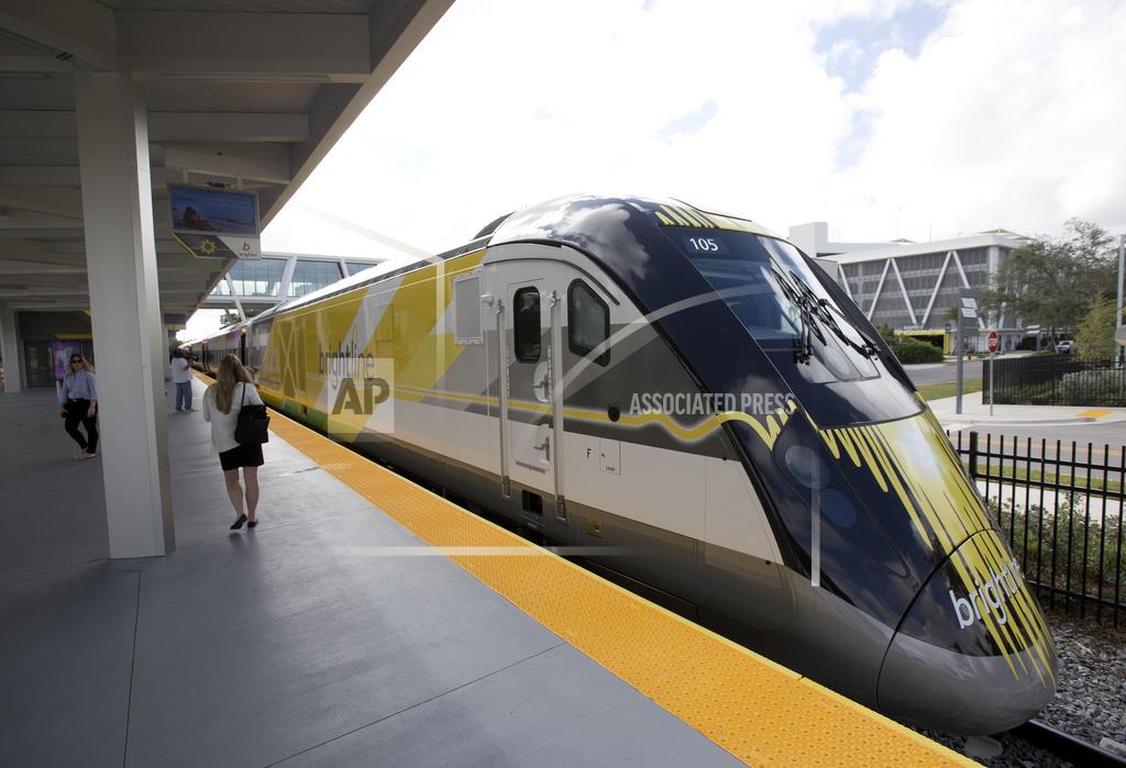 Work is set to begin Monday on a $12 billion high-speed passenger rail line between Las Vegas and the Los Angeles area, with officials projecting millions of ticket-buyers will be boarding trains by 2028. Brightline West, whose sister company already operates a fast train between Miami and Orlando in Florida, aims to lay 218 miles (351 kilometers) of new track between a terminal to be built just south of the Las Vegas Strip and another new facility in Rancho Cucamonga, California. Almost the full distance is to be built in the median of Interstate 15, with a station stop in San Bernardino County’s Victorville area. In a statement, Brightline Holdings founder and Chairperson Wes Edens called the moment “the foundation for a new industry.” Brightline aims to link other U.S. cities that are too near to each other for flying between them to make sense and too far for people to drive the distance, Edens said. CEO Mike Reininger has said the goal is to have trains operating in time for the Summer Olympics in Los Angeles in 2028. U.S. Transportation Secretary Pete Buttigieg is scheduled to take part in Monday's groundbreaking. Brightline received $6.5 billion in backing from the Biden administration, including a $3 billion grant from federal infrastructure funds and approval to sell another $2.5 billion in tax-exempt bonds. The company won federal authorization in 2020 to sell $1 billion in similar bonds. The project is touted as the first true high-speed passenger rail line in the nation, designed to reach speeds of 186 mph (300 kph), comparable to Japan’s Shinkansen bullet trains. The route between Vegas and L.A. is largely open space, with no convenient alternate to I-15. Brightline’s Southern California terminal will be at a commuter rail connection to downtown Los Angeles. The project outline says electric-powered trains will cut the four-hour trip across the Mojave Desert to a little more than two hours. Forecasts are for 11 million one-way passengers per year, or some 30,000 per day, with fares well below airline travel costs. The trains will offer rest rooms, Wi-Fi, food and beverage sales and the option to check luggage. Las Vegas is a popular driving destination for Southern Californians. Officials hope the train line will relieve congestion on I-15, where motorists often sit in miles of crawling traffic while returning home from a Las Vegas weekend. The Las Vegas area, now approaching 3 million residents, draws more than 40 million visitors per year. Passenger traffic at the city's Harry Reid International Airport set a record of 57.6 million people in 2023. An average of more than 44,000 automobiles per day crossed the California-Nevada state line on I-15 in 2023, according to Las Vegas Convention and Visitors Authority data. Florida-based Brightline Holdings already operates the Miami-to-Orlando line with trains reaching speeds up to 125 mph (200 kph). It launched service in 2018 and expanded service to Orlando International Airport last September. It offers 16 round-trips per day, with one-way tickets for the 235-mile (378-kilometer) distance costing about $80. Other fast trains in the U.S. include Amtrak’s Acela, which can top 150 mph (241 kph) while sharing tracks with freight and commuter service between Boston and Washington, D.C. Ideas for connecting other U.S. cities with high-speed passenger trains have been floated in recent years, including Dallas to Houston; Atlanta to Charlotte, North Carolina; and Chicago to St. Louis. Most have faced delays. In California, voters in 2008 approved a proposed 500-mile (805-kilometer) rail line linking Los Angeles and San Francisco, but the plan has been beset by rising costs and routing disputes. A 2022 business plan by the California High-Speed Rail Authority projected the cost had more than tripled to $105 billion.