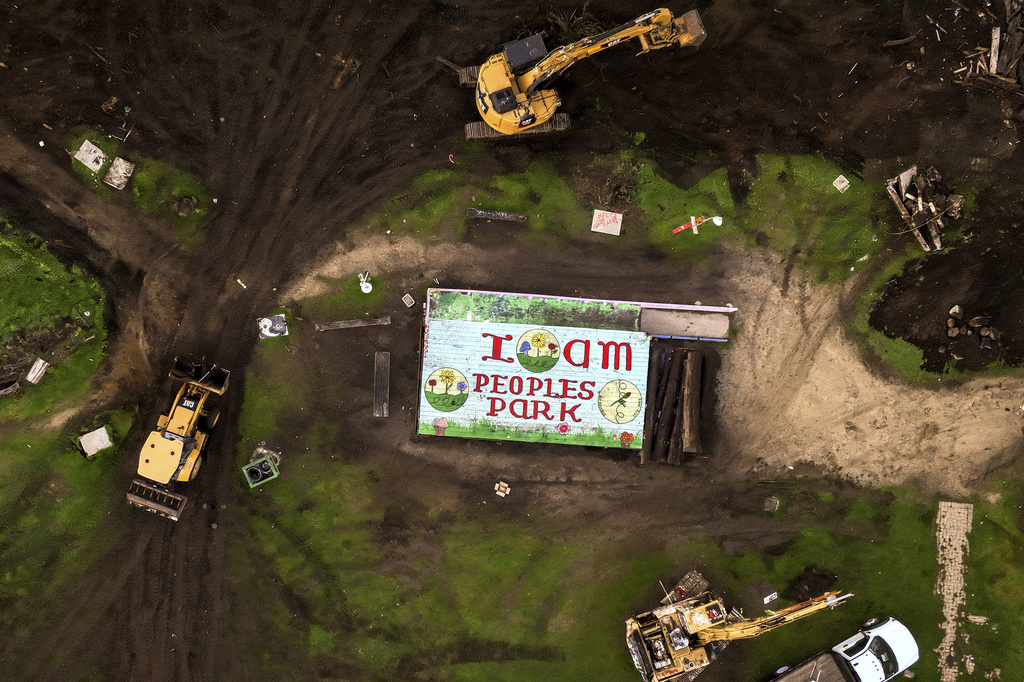 Stacked shipping containers begin to surround People's Park in Berkeley, Calif. on Thursday, Jan. 4, 2024. A California Supreme Court ruling will allow student housing at University of California to be built at Berkeley's historic People's Park. (Brontë Wittpenn/San Francisco Chronicle via AP, File)