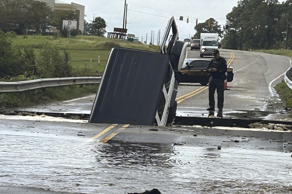 'Firehose' storm hits part of North Carolina and scientists see climate change