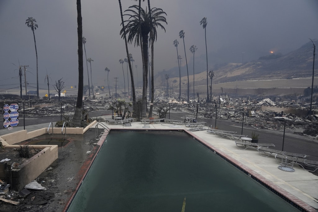 Wildfires burn out of control across LA and kill 5 as thousands flee homes