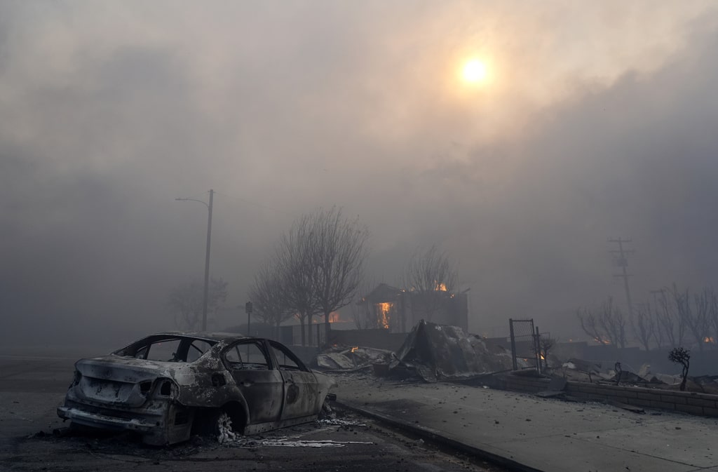 Wildfires burn out of control across LA and kill 5 as thousands flee homes