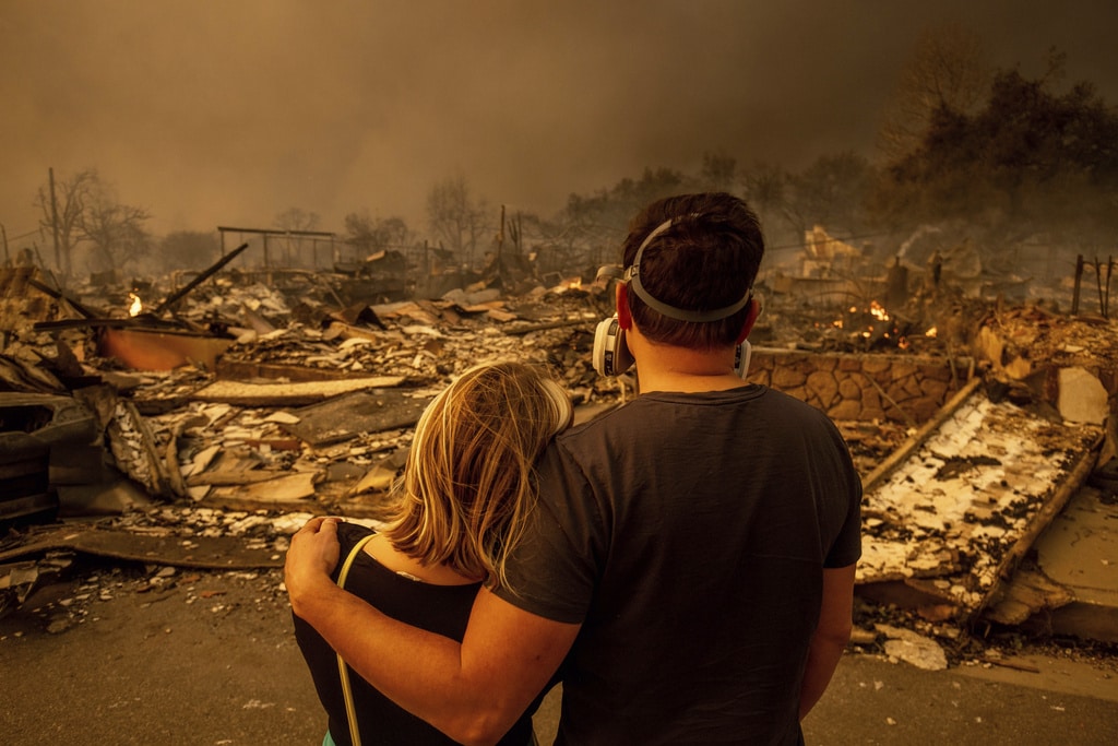 Wildfires burn out of control across LA and kill 5 as thousands flee homes