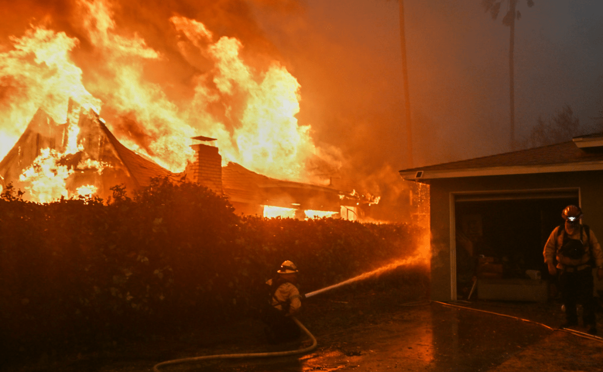 Wildfires burn out of control across LA and kill 5 as thousands flee homes