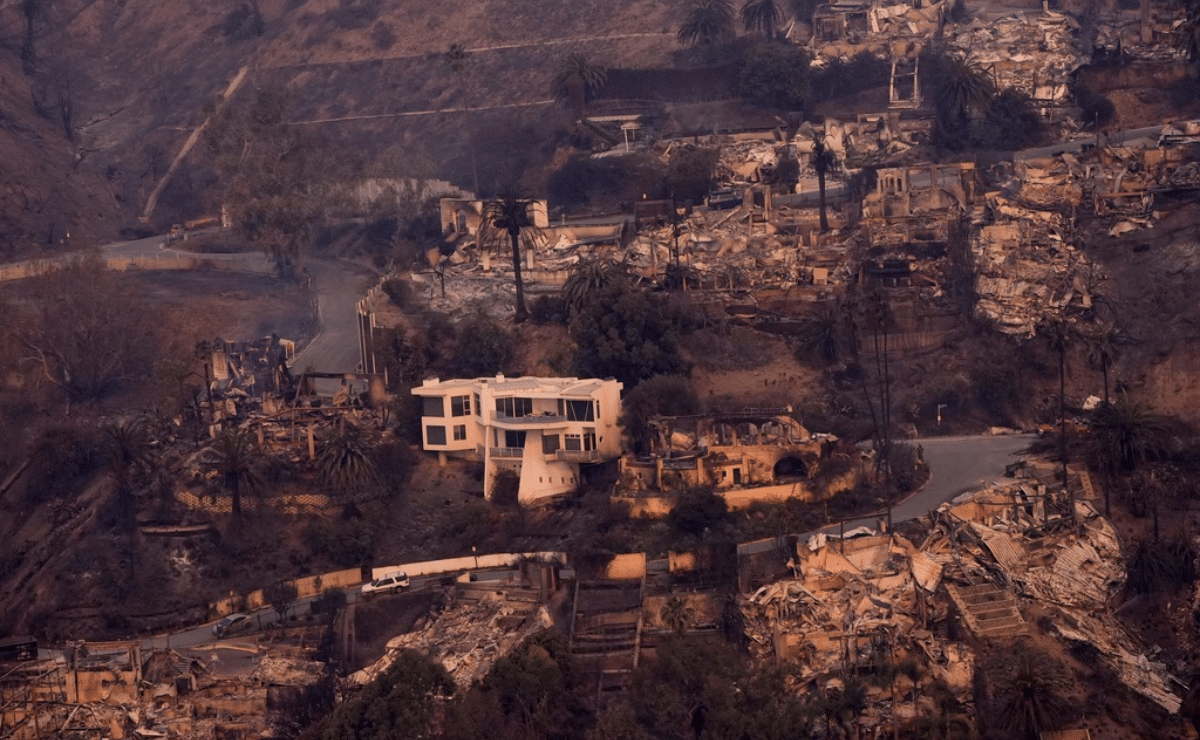 At least five people were killed and thousands of structures were burned as fierce wildfires raged in the Los Angeles area, officials said. Fast-moving flames blazed through homes and businesses as residents fled smoke-filled canyons and picturesque neighborhoods that are home to many celebrities. Many of the towering fires that began Tuesday were fueled by powerful Santa Ana winds, which gusted to more than 70 mph (112 kph) in some spots. The winds dropped Thursday, but the National Weather Service warned that even the reduced gusts could still spread fire rapidly and the wind is expected to strengthen again Thursday evening. Another round of strong winds may form Tuesday. The exact death toll remained unclear, but it was expected to rise as crews begin to search the rubble. Gov. Gavin Newsom said California has deployed more than 1,400 firefighting personnel to battle the blazes. Oregon, Washington, Utah, New Mexico and Arizona dispatched teams to assist. AccuWeather, a private company that provides data on weather and its impact, increased its estimate of the damage and economic loss to $135 billion to $150 billion. Government officials have not yet released any damage estimates. Here's what to know about the fires: The Palisades Fire is the most destructive in LA history Thousands of structures have been damaged or destroyed in the hilly coastal neighborhood of Pacific Palisades, making it the most destructive fire in Los Angeles history. The wreckage surpassed that of the Sayre Fire of November 2008, which destroyed 604 structures in Sylmar, the northernmost suburb of the city, according to statistics kept by the Wildfire Alliance, a partnership between the city’s fire department and MySafe:LA. Nearly 27 square miles (nearly 70 square kilometers) burned in Pacific Palisades, which is dotted with celebrity homes and was memorialized by the Beach Boys in their 1960s hit “Surfin’ USA.” The flames torched part of Palisades Charter High School, which has been featured in many Hollywood productions, including the 1976 horror movie “Carrie” and the TV series “Teen Wolf.” Actor Billy Crystal and his wife Janice lost their home of 45 years. Other fires are also causing havoc Farther inland, the Eaton Fire north of Pasadena burned more than 4,000 structures, which includes homes, apartment or commercial buildings and vehicles. It also substantially damaged five school campuses in Altadena and scorched more than 16.5 square miles (43 square kilometers). Employees at a senior center pushed dozens of residents in wheelchairs and hospital beds to a parking lot to escape. The Los Angeles Fire Department issued evacuation orders Thursday afternoon for a new blaze, named the Kenneth Fire, which broke out near West Hills, a neighborhood densely packed with homes in the San Fernando Valley about 11 miles (18 kilometers) northwest of Pacific Palisades. The Hurst Fire, which started Tuesday night, prompted evacuations in Sylmar in the San Fernando Valley and grew to 1 square mile (2.6 square kilometers). And in the Hollywood Hills, the Sunset Fire broke out Wednesday evening and burned near the Hollywood Bowl and other iconic landmarks. Firefighters were able to hold it to under 1 square mile (2.6 square kilometers), and evacuation orders were lifted Thursday morning. Altogether the fires have consumed about 45 square miles (117 square kilometers) — roughly the size of San Francisco. Biden approves additional funding President Joe Biden said during a White House briefing with staff Thursday that he was making federal resources available and approved additional funding to help California battle the fires, saying they were the “worst fires to ever hit Los Angeles. Ever.” The new funding will cover 100% of the cost for 180 days for hazardous materials removal, temporary shelters, first responder salaries and measures to protect life, he said. Biden said he was not in a position to answer whether California would continue to receive federal funding to help combat the fires after President-elect Donald Trump takes office Jan. 20. “I pray to God they will,” Biden said. Thousands have been ordered to evacuate Nearly 180,000 people were under evacuation orders Thursday. The flames threatened highly populated and affluent neighborhoods, including Calabasas and Santa Monica, home to California’s rich and famous. Hollywood stars including Mark Hamill, Mandy Moore and James Woods were among those forced to flee, and Moore later said she lost her home in Altadena. Bad air quality is affecting millions A thick cloud of smoke and ash filled the skies, prompting air and dust advisories for 17 million people across a vast stretch of Southern California, according to the South Coast Air Quality Management District. The worst conditions were in the vicinity of the fires. In East Los Angeles, the air quality index hit an unhealthy 173. Good air quality is considered to be 50 or less. Dr. Puneet Gupta, the assistant medical director for the Los Angeles County Fire Department, said wildfire smoke can cause heart attacks and worsen asthma, while burning homes can release cyanide and carbon dioxide. Several events have been canceled and postponed The Critics Choice Awards rescheduled Sunday ceremonies in Santa Monica for Jan. 26. The organization that puts on the Oscars extended the voting window for Academy Award nominations and delayed next week’s planned nominations announcement. Film studios canceled two movie premieres. The Universal Studios Hollywood theme park closed for the day, but Disneyland, which is farther from the fires in Anaheim, remained open. Universal Studios also canceled shooting for numerous series, including “Hacks,” “Ted Lasso” and “Suits LA.” All schools were closed Thursday in the Los Angeles Unified School District. The NFL has moved the Los Angeles Rams’ wild-card playoff game against the Minnesota Vikings to Arizona because of the fires. The game will be played Monday night at the home of the Arizona Cardinals in suburban Glendale, Arizona. The NBA postponed the Lakers' game against the Hornets, and the NFL said it is monitoring conditions to determine if Monday's playoff game between the Los Angeles Rams and Minnesota Vikings will be affected. Many people are without power and water More than 415,000 customers were without electricity in Southern California, about half of them in Los Angeles County, according to PowerOutage.us, which tracks outages nationwide. Sewer, water and power infrastructure across the region has been significantly damaged, officials said. Looters arrested Looters who take advantage of the wildfire crisis by targeting vulnerable communities will be prosecuted, officials promised. There have been at least 20 arrests. “This is simply unacceptable,” Los Angeles County Board of Supervisors Chair Kathryn Barger said. “I promise you, you will be held accountable.” Officials planned to implement a curfew around the two main fires as early as Thursday evening, and National Guard members were expected to be stationed near burn areas.