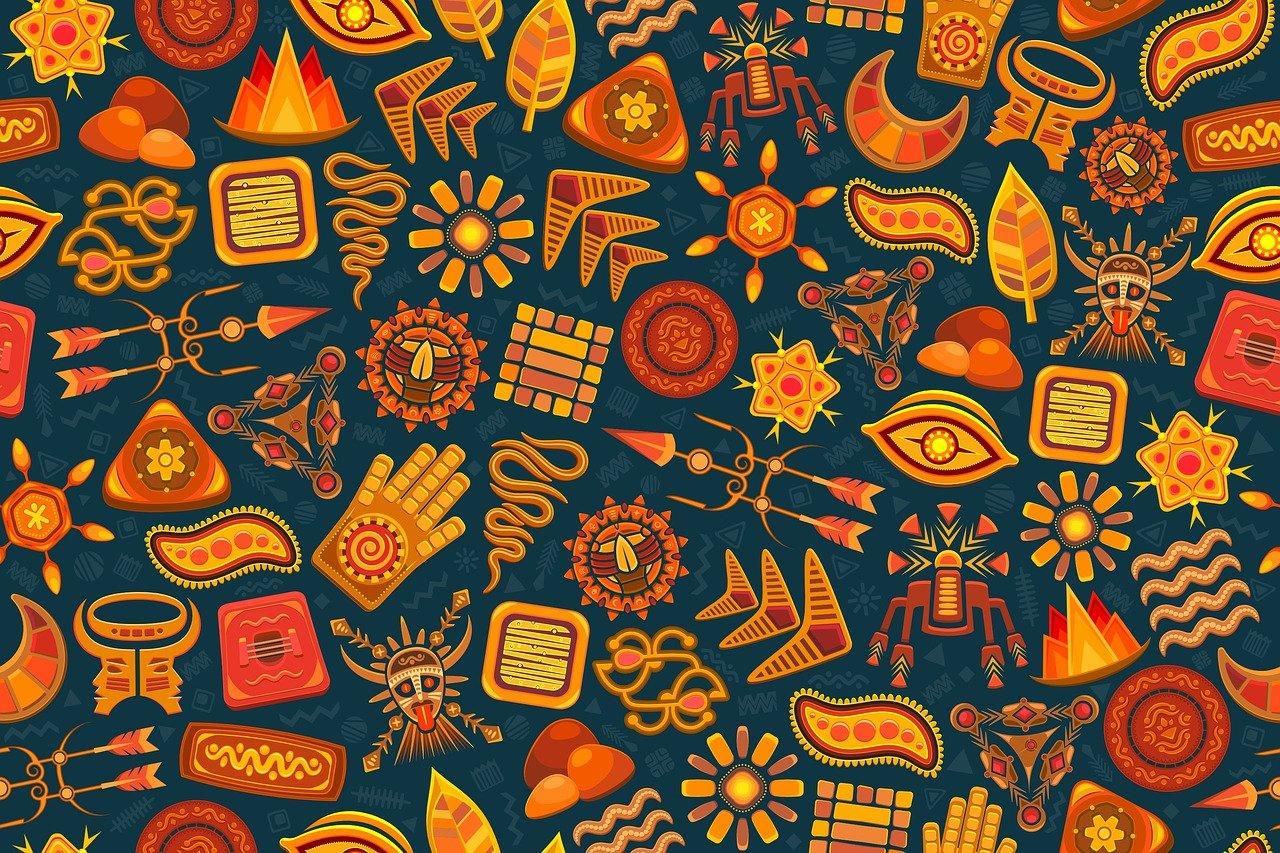 Colorful tribal-inspired pattern with Native American symbols, including sun motifs, feathers, and traditional designs, representing cultural heritage and symbolism.