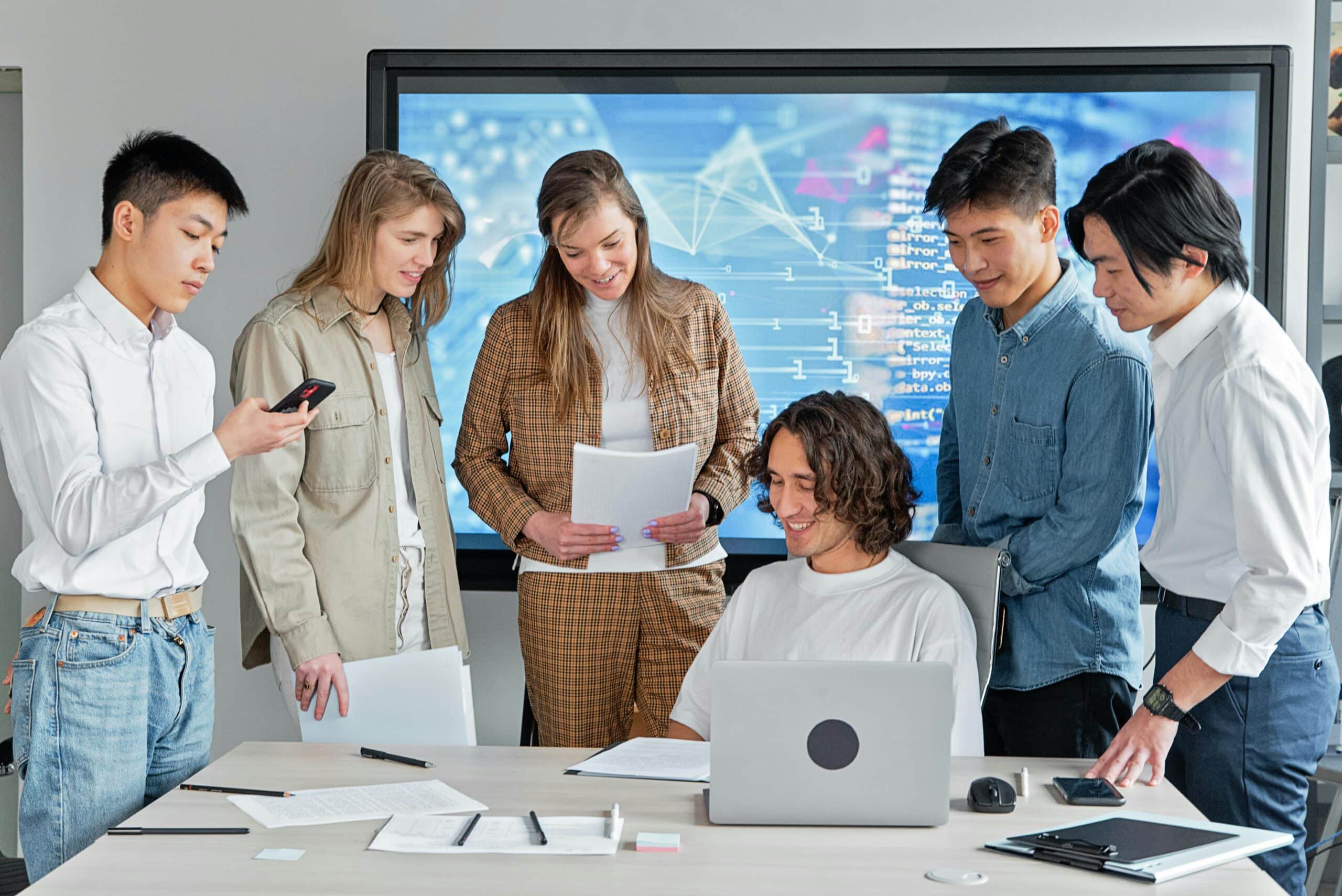 A business team analyzing customer feedback on a digital dashboard, emphasizing a customer-first approach in an online business environment.