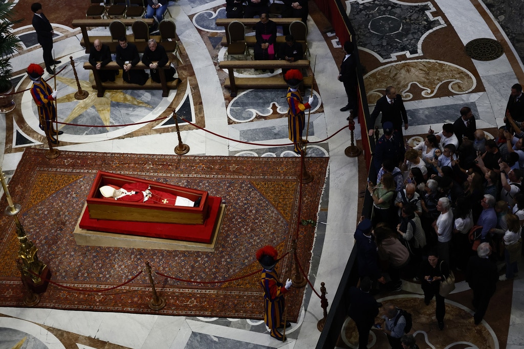 Catholic faithful pay their final respects to Pope Francis as public viewing begins