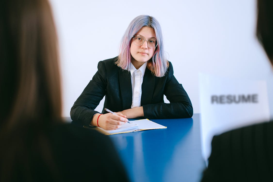 Young professional at a meeting or loan consultation, representing a borrower reviewing loan options and making a final decision about Republic Finance