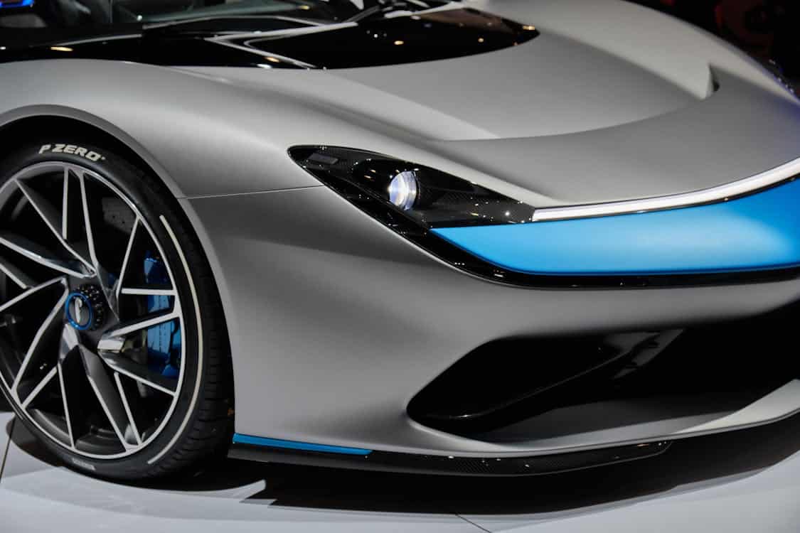 Close-up of a sleek luxury sports car in an article section highlighting the benefits of Capital One Auto Financing such as low credit score approval, flexible loan terms, and rewards programs.