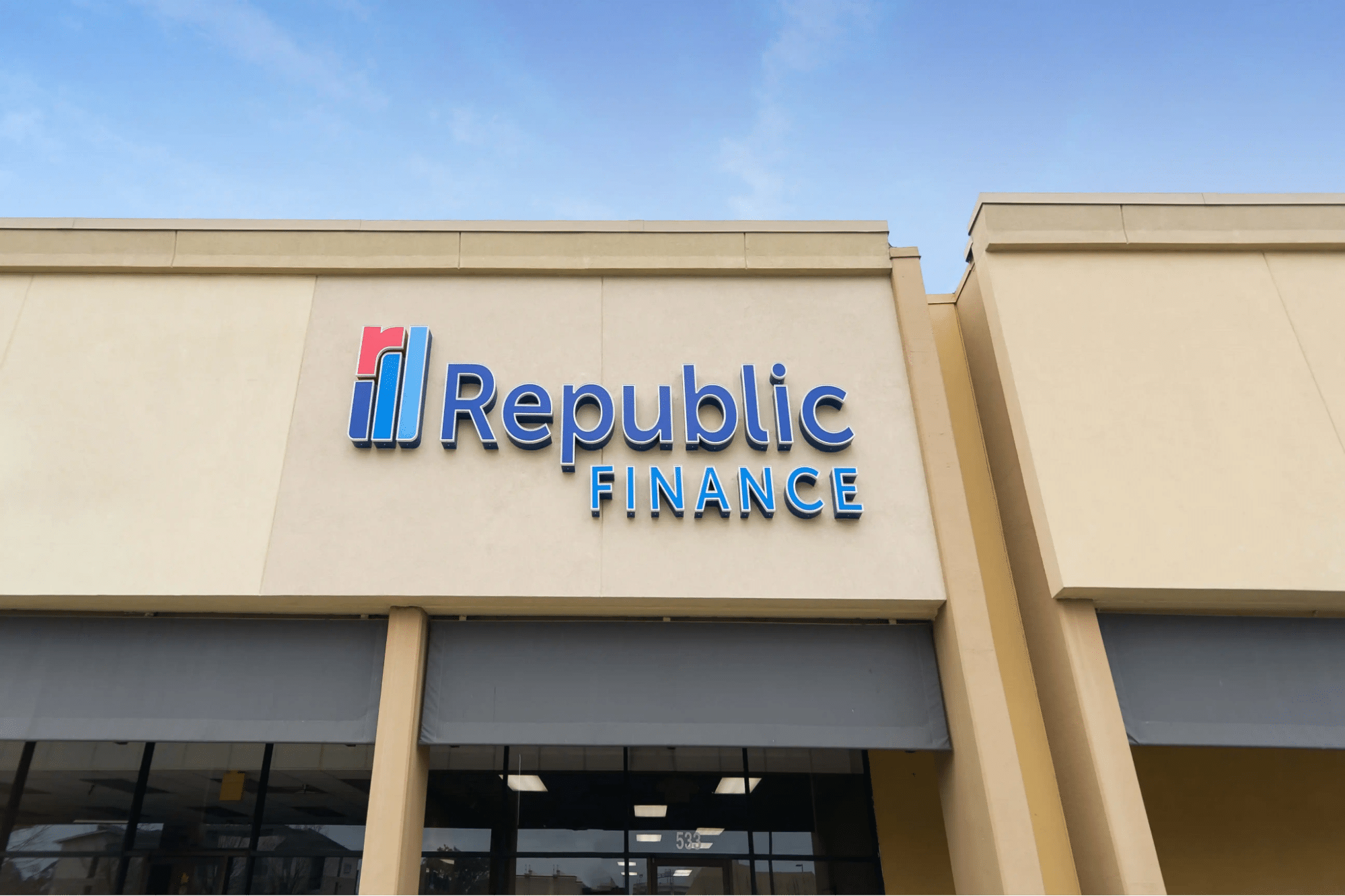 Alternate Republic Finance storefront with blue sky background and logo signage