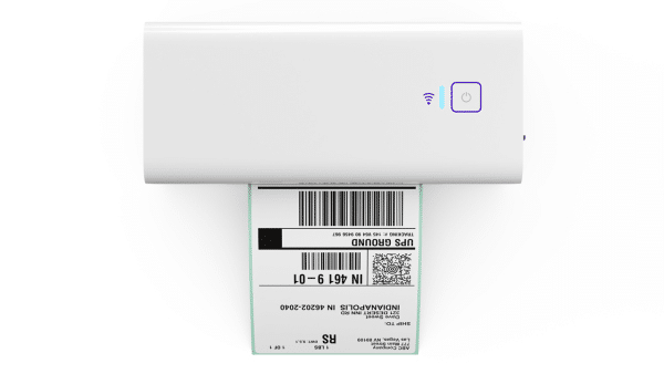 Top view of Rollo X1040 wireless thermal label printer printing a 4-by-6 UPS shipping label.