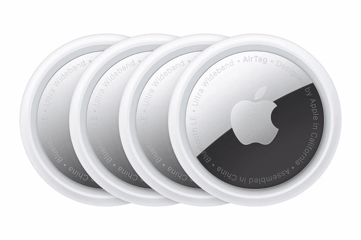 Four Apple AirTags in a pack for tracking keys, luggage, and devices using the Find My app.