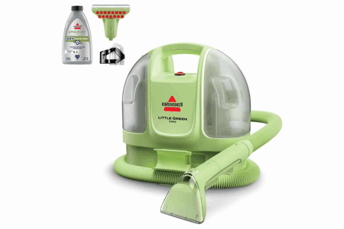 Bissell Little Green portable carpet cleaner with hose and cleaning formula for stain removal.
