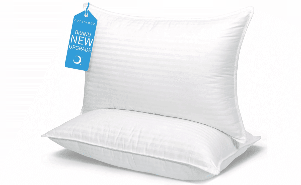 Two white queen-size Cozsinoor bed pillows with cooling fabric and plush comfort.