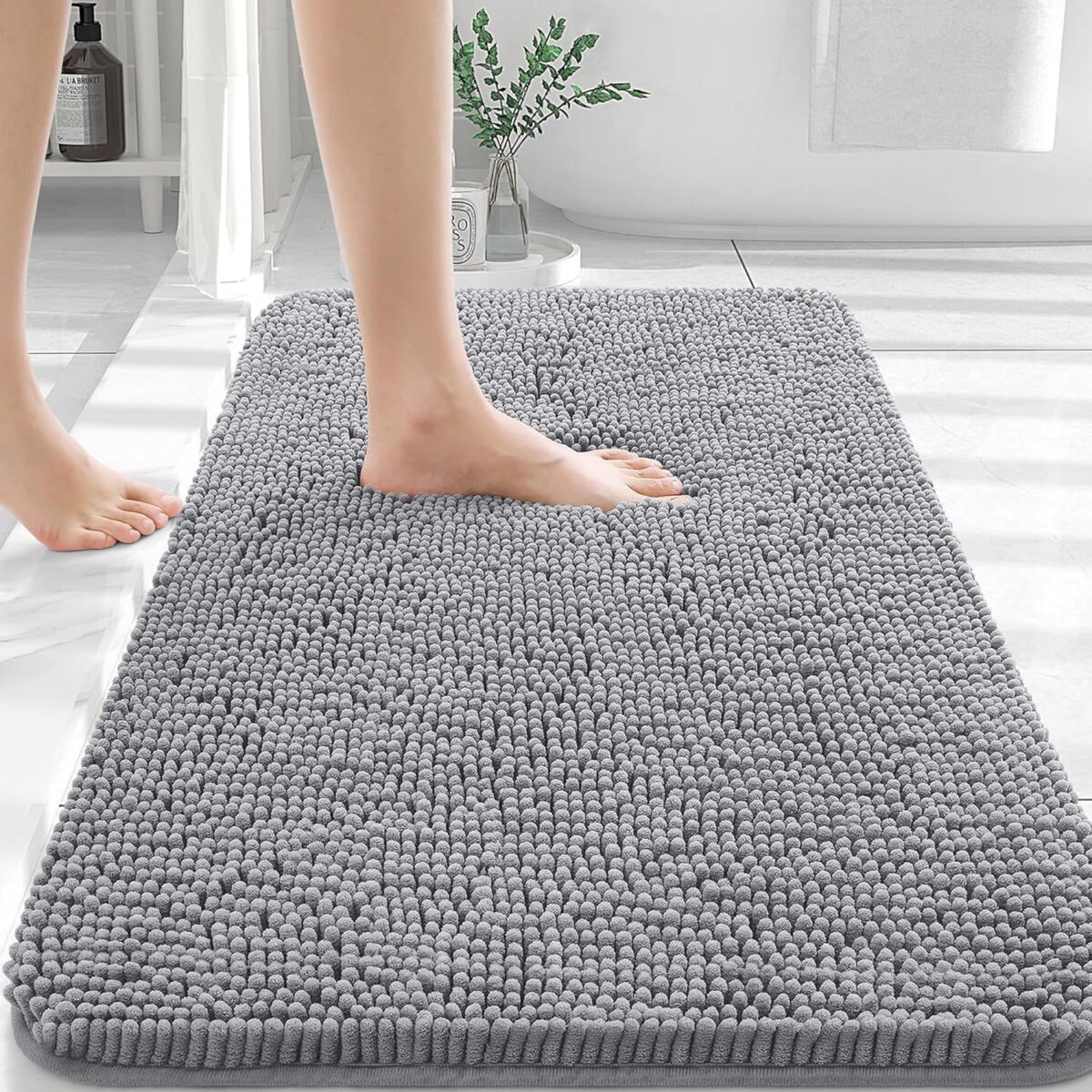 Gray Olanly 30×20 chenille bathroom rug with soft, absorbent texture under bare feet.